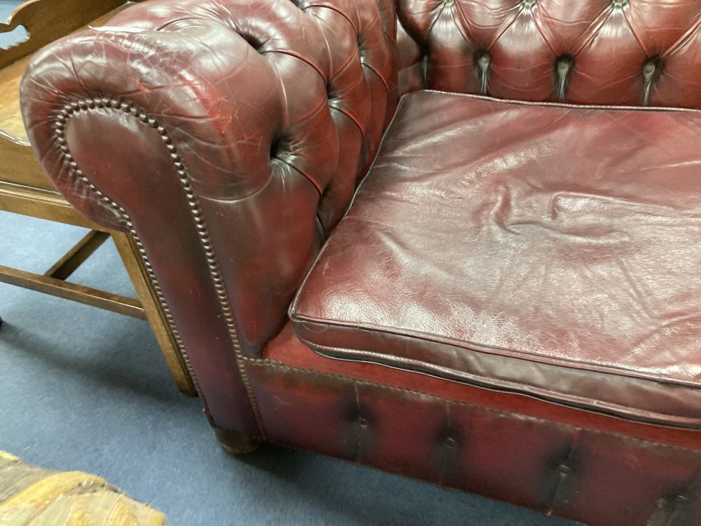 A Victorian style buttoned burgundy leather three seater Chesterfield settee, width 190cm depth 85cm height 72cm